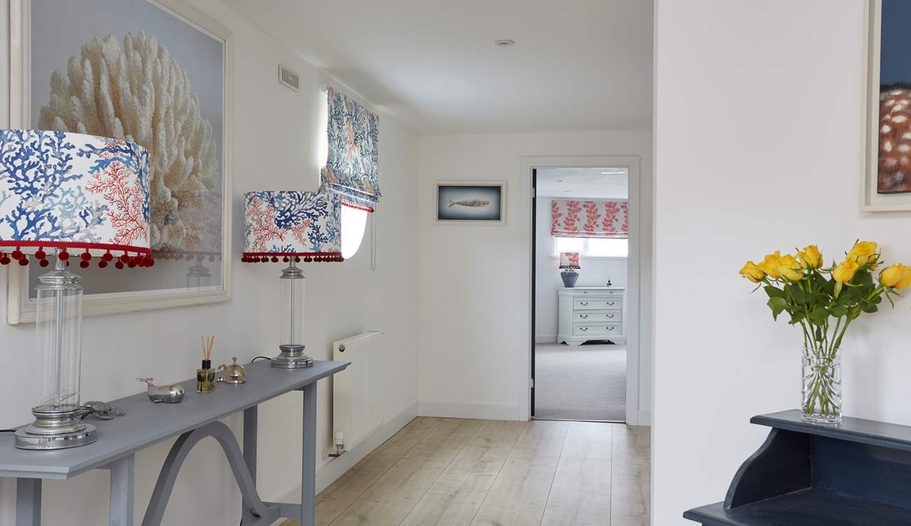 Access to the downstairs bedrooms is from a staircase in the entrance hallway.