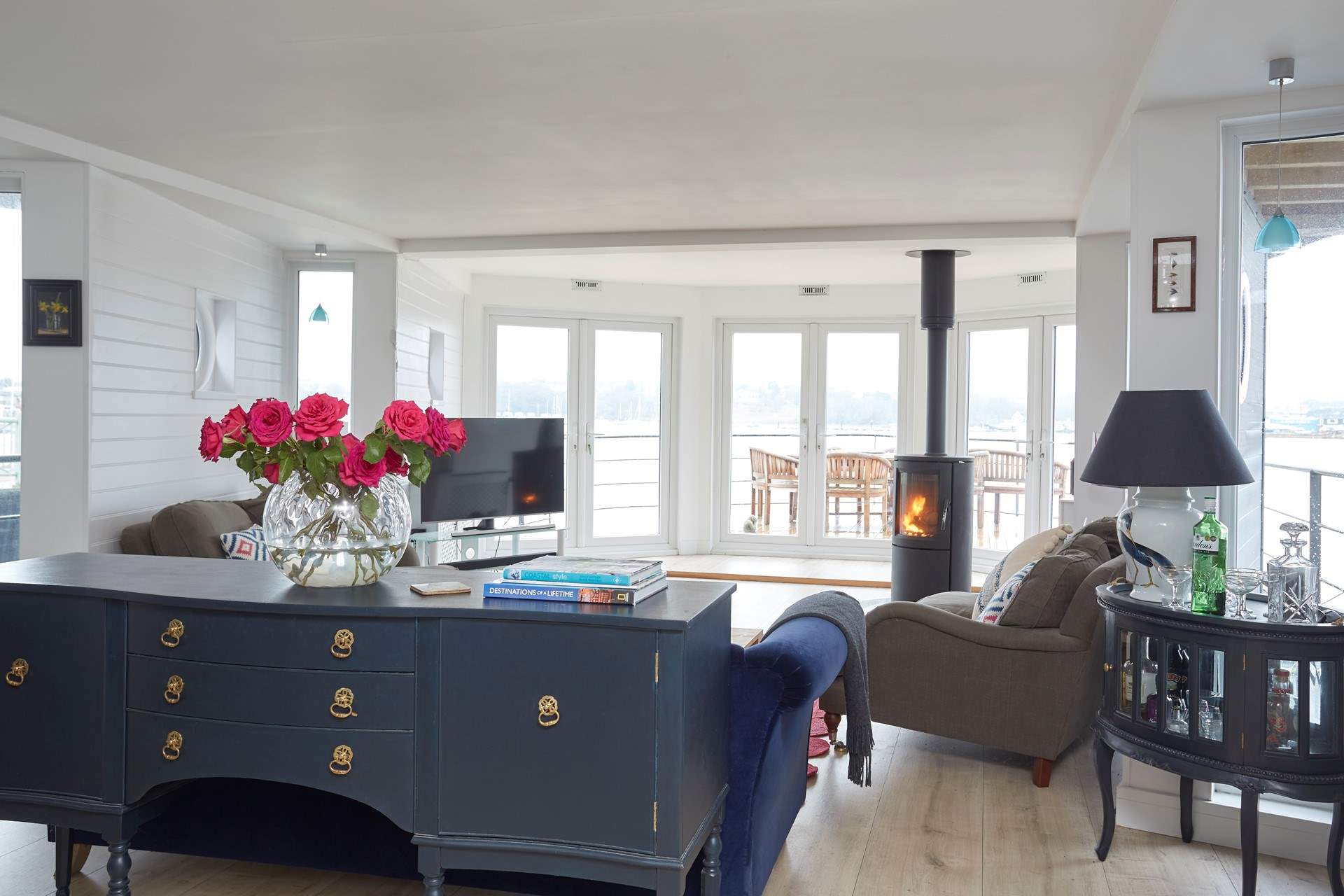 Double doors open out onto the bow of the boat with the choice of al fresco dining around the teak table and chairs.