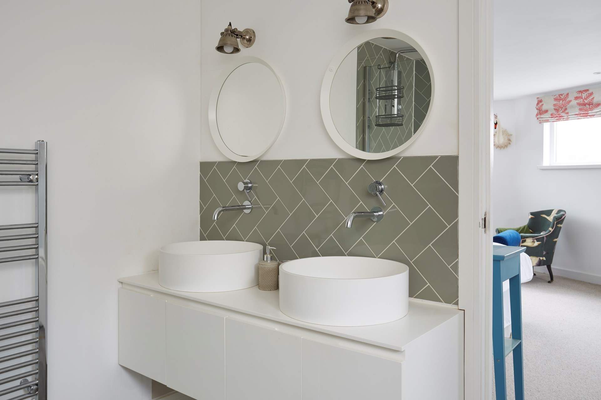 You won't be short of space in the main bedroom en suite with double sinks, bath and a separate shower cubicle.