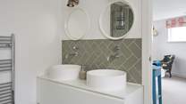 You won't be short of space in the main bedroom en suite with double sinks, bath and a separate shower cubicle.