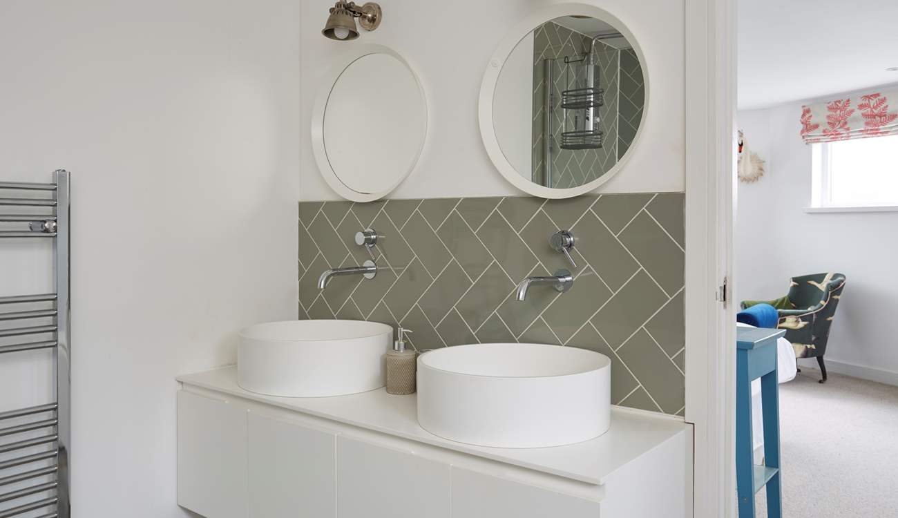 You won't be short of space in the main bedroom en suite with double sinks, bath and a separate shower cubicle.