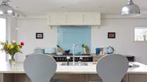 Keep the chef company sitting at the kitchen island.