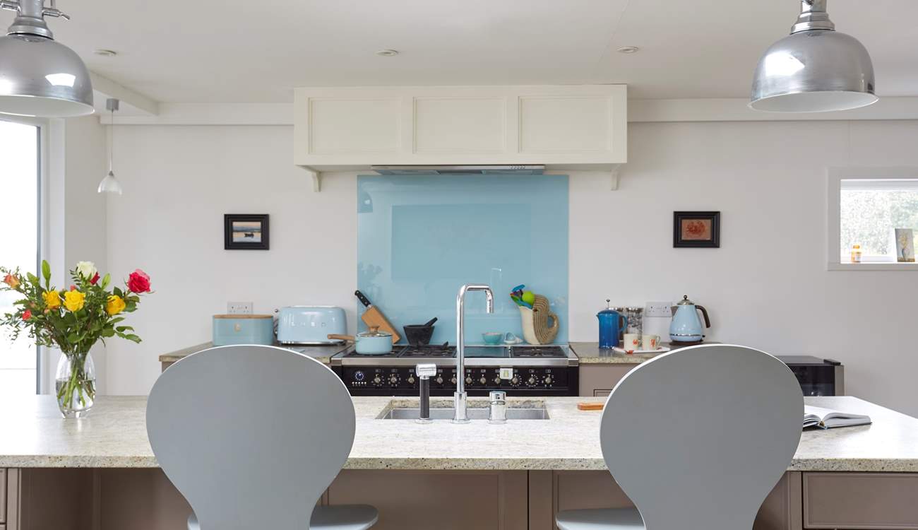 Keep the chef company sitting at the kitchen island.