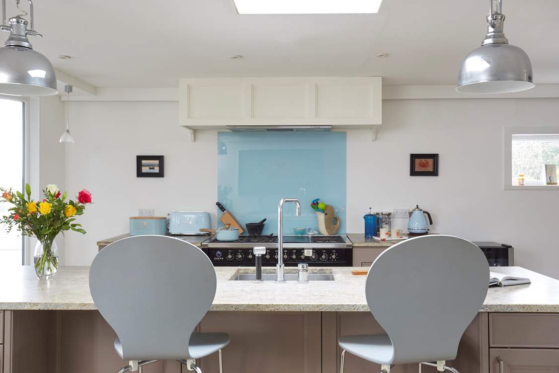 Keep the chef company sitting at the kitchen island.