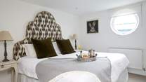 Bedroom 2 with opulent upholstered headboard to super-king bed and access to shared shower-room with bedroom 3.