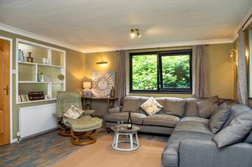 The sitting-room has plenty of space for everyone (please be aware the green arm chair has been replaced with another chair).