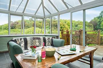 The conservatory links the kitchen/diner with the outside space.