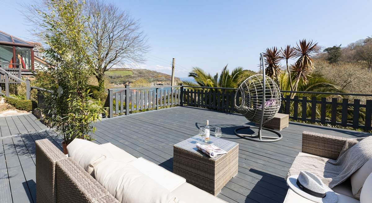 Just a few steps from the conservatory is this stunning decked area with fabulous views and comfy seating - what a dreamy location. 