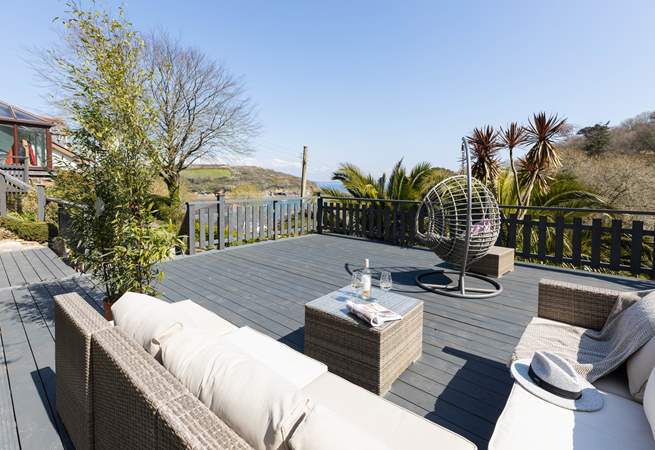 Just a few steps from the conservatory is this stunning decking with fabulous views and comfy seating - what a dreamy location. 