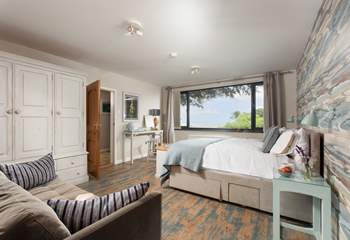 Lie in bed and enjoy the sea breeze in bedroom 1.