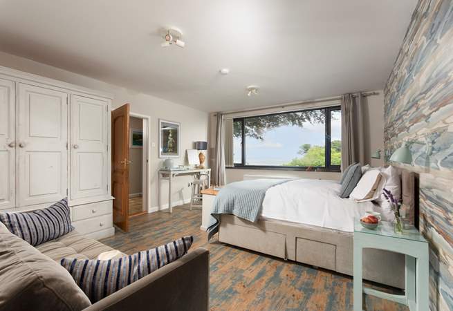 Lie in bed and enjoy the sea breeze in bedroom 1.
