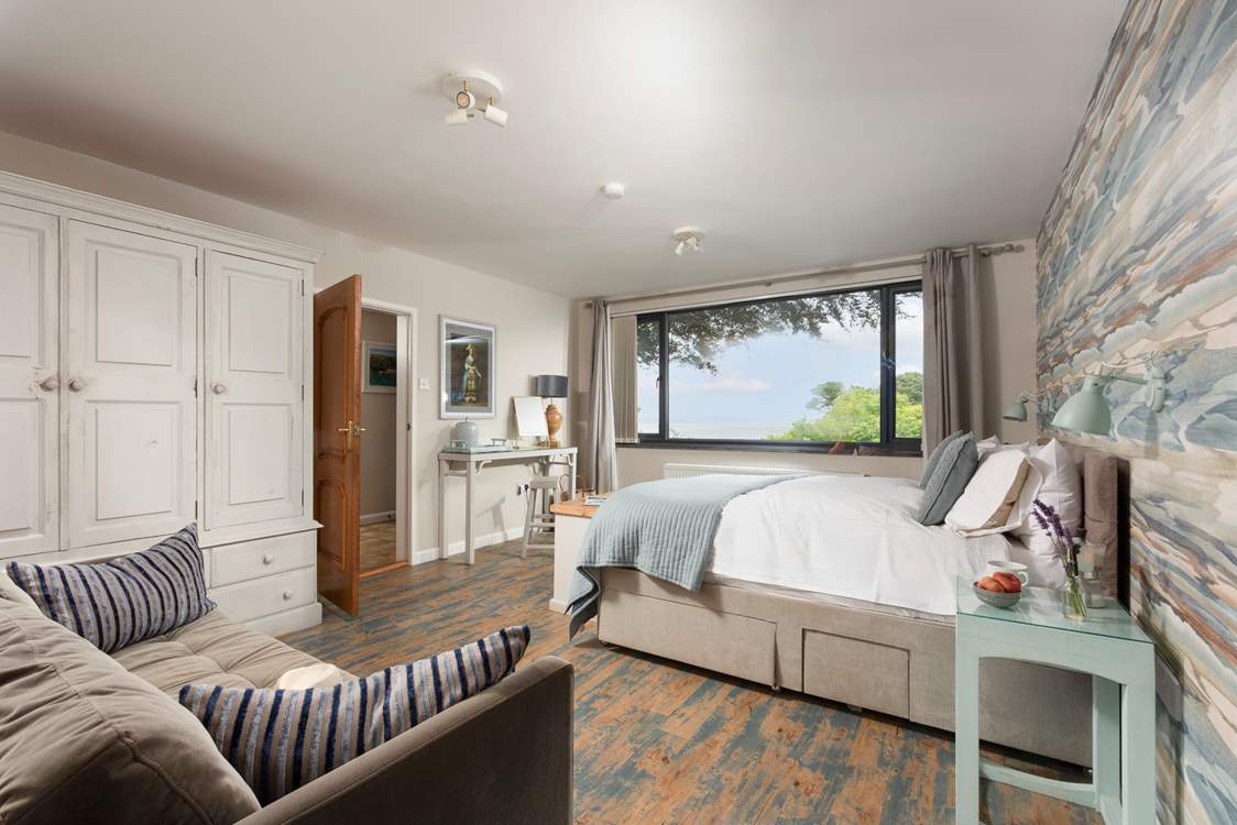 Lie in bed and enjoy the sea breeze in bedroom 1.