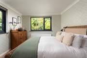 Calming green tones can be found in bedroom 3.
