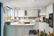 The kitchen/dining-room is light and spacious, perfect for cooking and dining with friends or family.