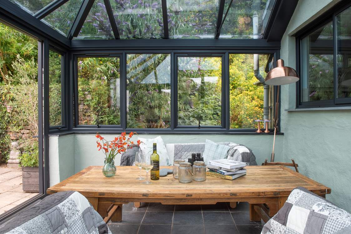 The conservatory leads to the decking in the garden.