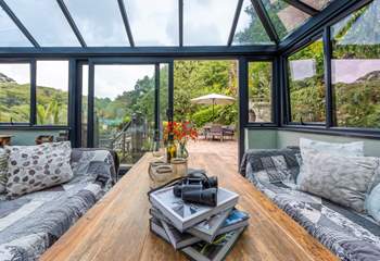 The conservatory links the kitchen/diner with the outside space.