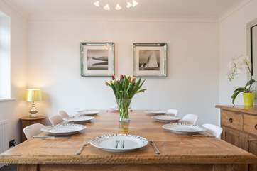 The kitchen/dining-room is a light-filled space which looks out to the swimming pool and patio area.