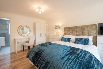 The master bedroom is on the lower ground floor with en suite wet-room.