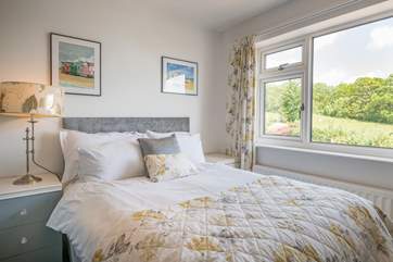 Pretty second floor double bedroom located to the rear is overlooking the garden and has wonderful sea views.