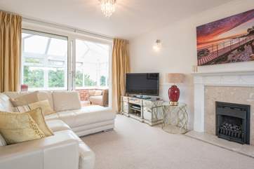 The first floor sitting-room leads through to the conservatory, a place you can relax and plan your days ahead.