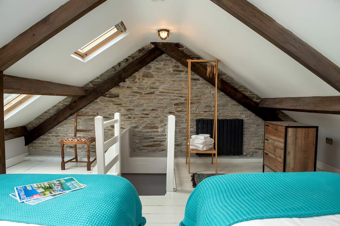 The stairs lead down from bedroom 2 - there is a door at the bottom of the stairs for privacy.