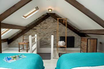 The stairs lead down from bedroom 2 - there is a door at the bottom of the stairs for privacy.