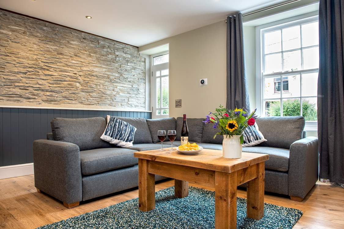 The cottage has retained its charm with the exposed stone wall, sash windows and inglenook fireplace.