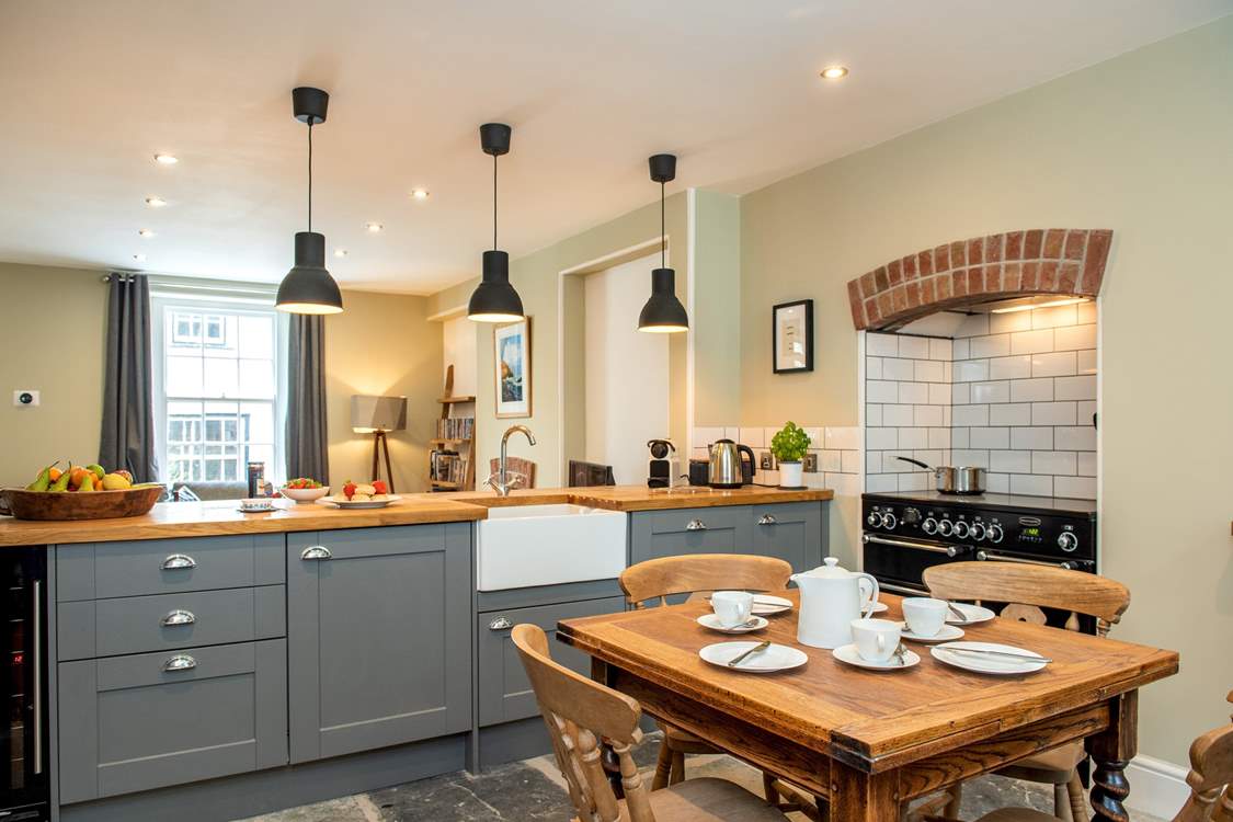 The kitchen cupboards provide a natural divide from the living area.