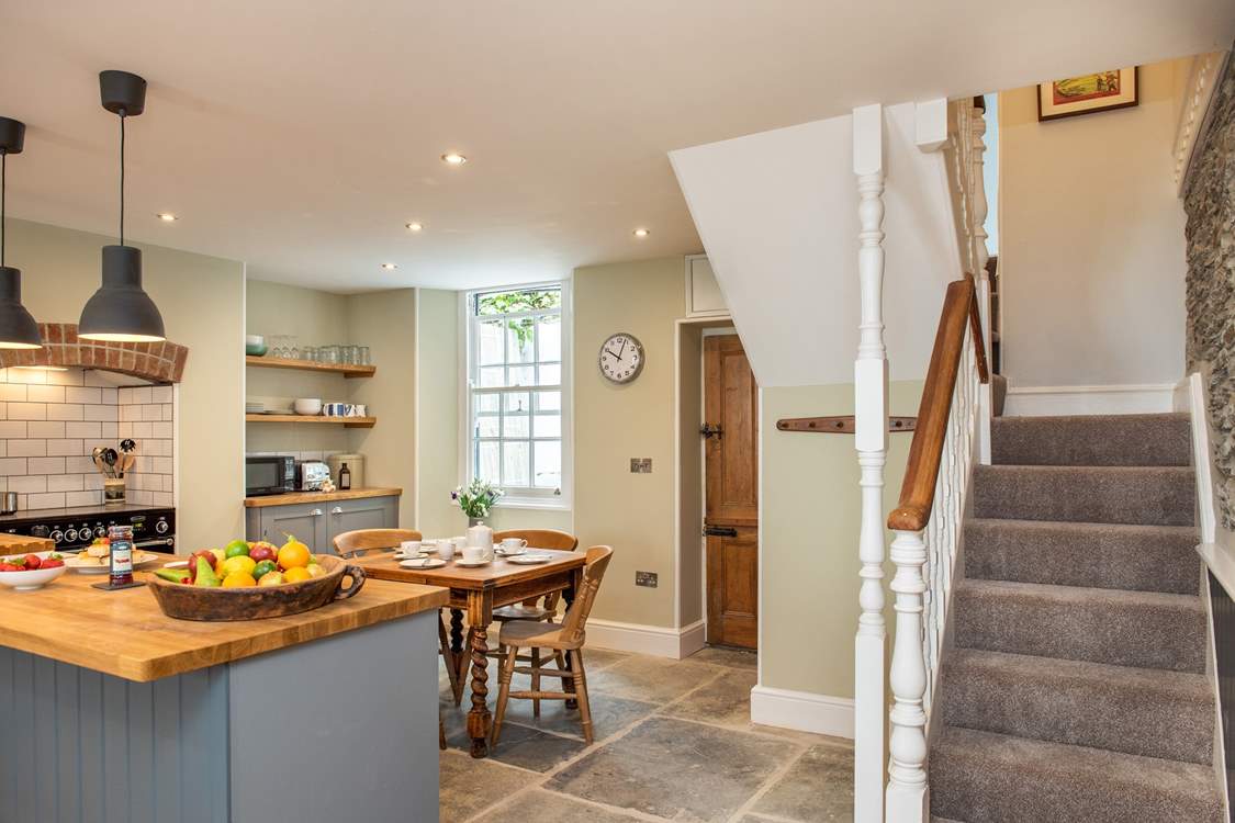 From the kitchen the door leads to a small utility-room and cloakroom.