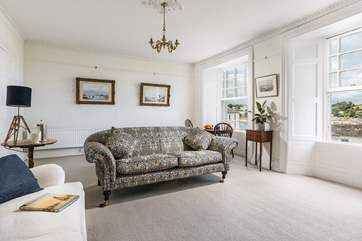 Open views are not blocked by curtains in the light sitting-room.