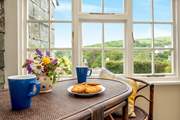 The sun-room is the ideal spot for holiday breakfasts or morning coffee.