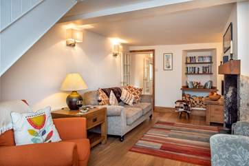 The cottage sitting-room is very cosy.