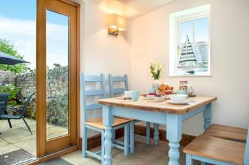 The dining-area with patio doors leading out to the courtyard.