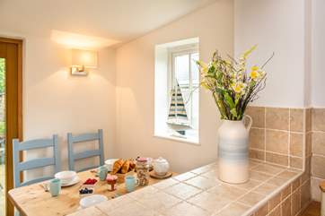 The dining-area is set down from the kitchen.