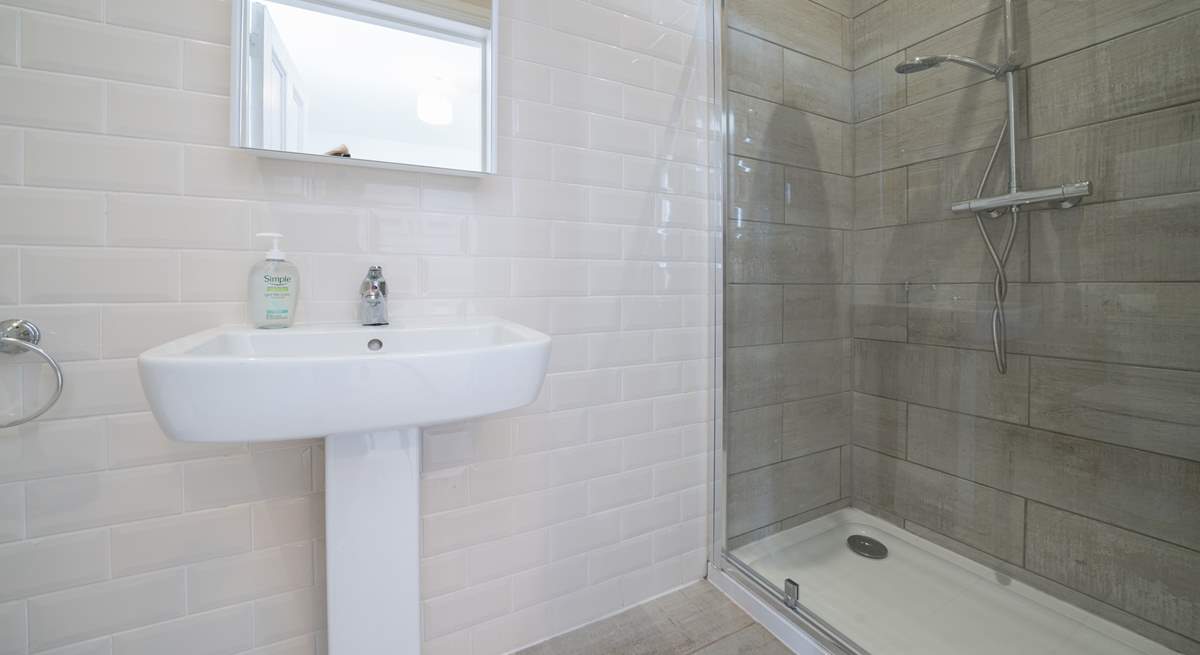 The en suite to the main bedroom has a rainfall shower, perfect after a day on the beach.