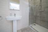 The en suite to the main bedroom has a rainfall shower, perfect after a day on the beach.