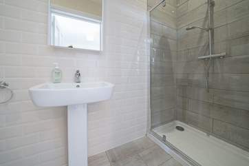 The en suite to the master bedroom has a walk-in rainfall shower, perfect after a day on the beach.