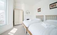 The lovely light twin bedroom.