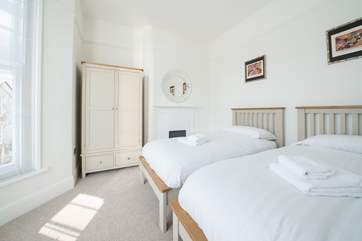 The lovely light twin bedroom.