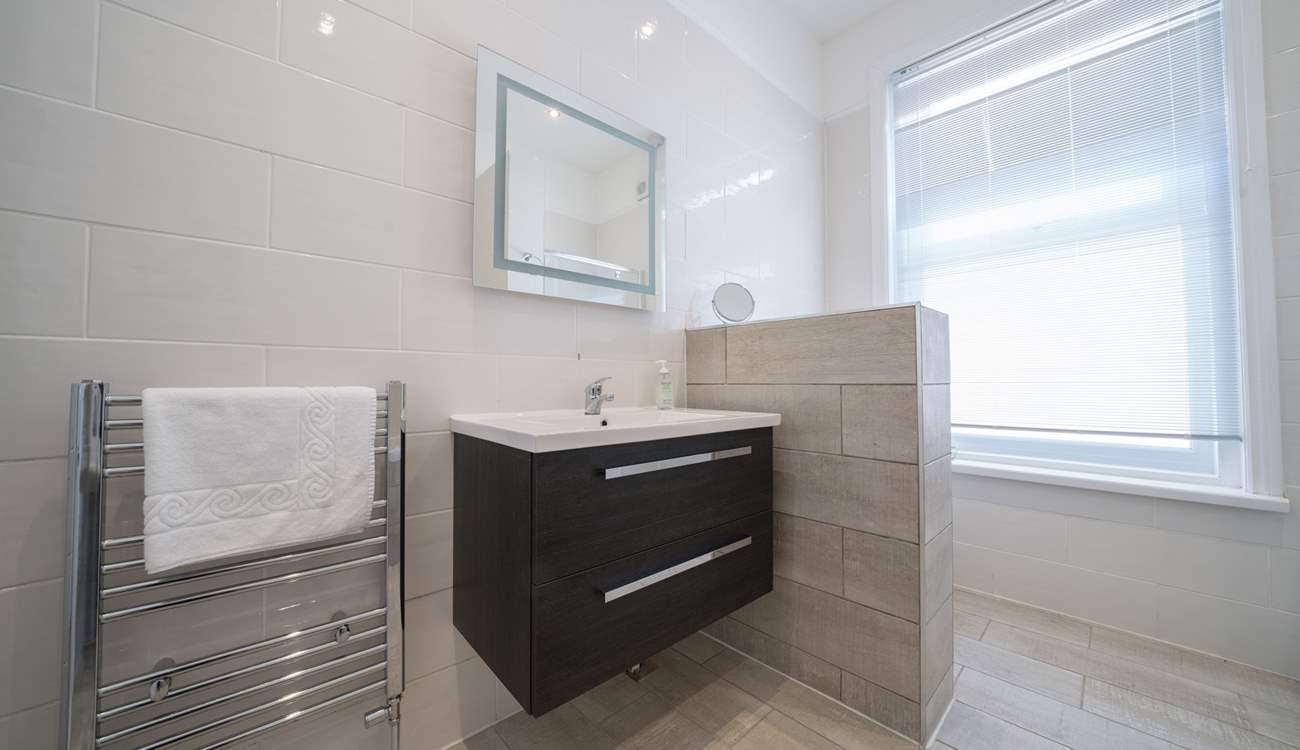 The loo is conveniently tucked away behind the modesty screen.