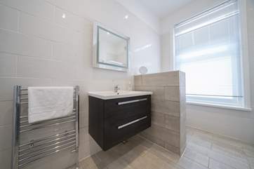 The loo is conveniently tucked away behind the modesty screen.