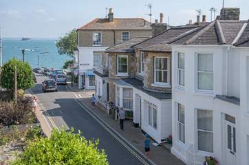 Watch the world go by from the bay window of the living-room.