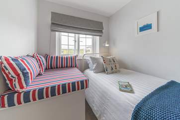 Very cute twin bedroom with cosy corner so the little ones can snuggle up with their favourite book.