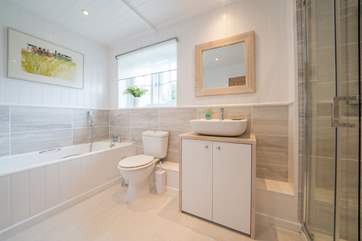 First floor family bathroom with bath and shower cubicle.