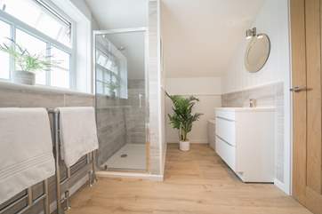 ...separate shower cubicle and double wash-basin.
