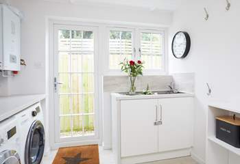 Plenty of space in the utility room and wall hooks to hang your towels from the beach.