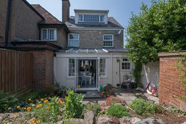 Patio doors from the dining-area lead out to the patio - take care on the uneven steps (seven in total) that lead to the garden area.