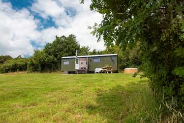Nestled into a pretty meadow, surrounded by countryside.