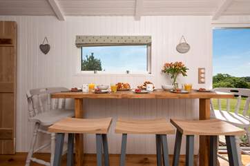 The dining area has a picture window, so you can enjoy the views whether dining inside or out.