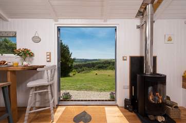 Just look at that gorgeous view! And there's a cosy wood-burner too - perfect for out-of-season breaks.